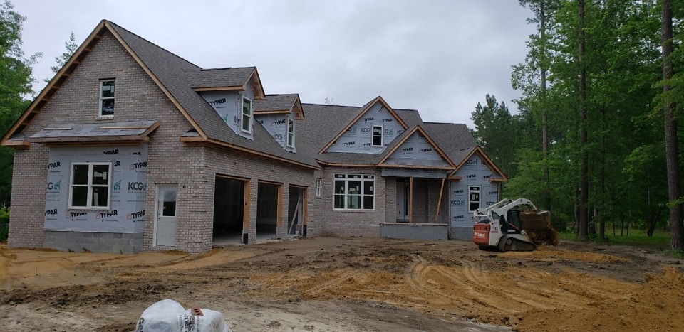 Exterior finishes of The Bluestone Plan 1302. 