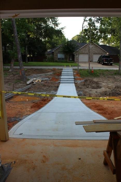 Concrete driveway and parking pad. 