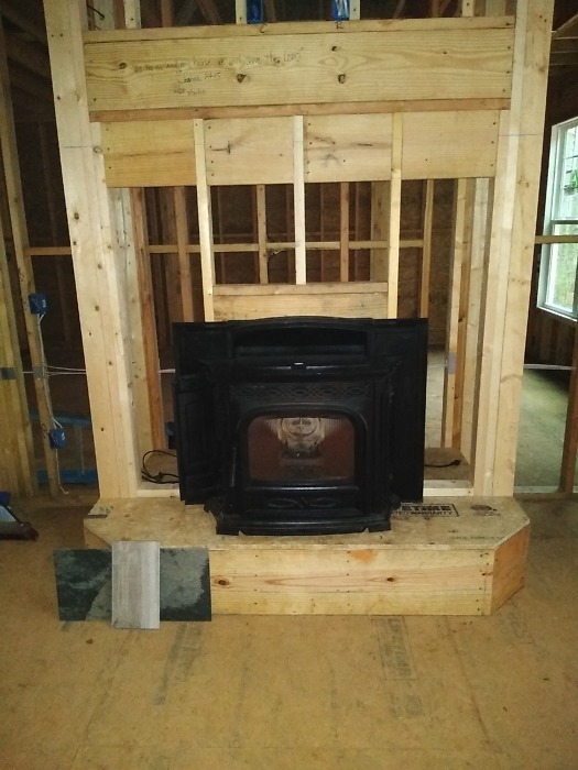 Interior framing and fireplace. 